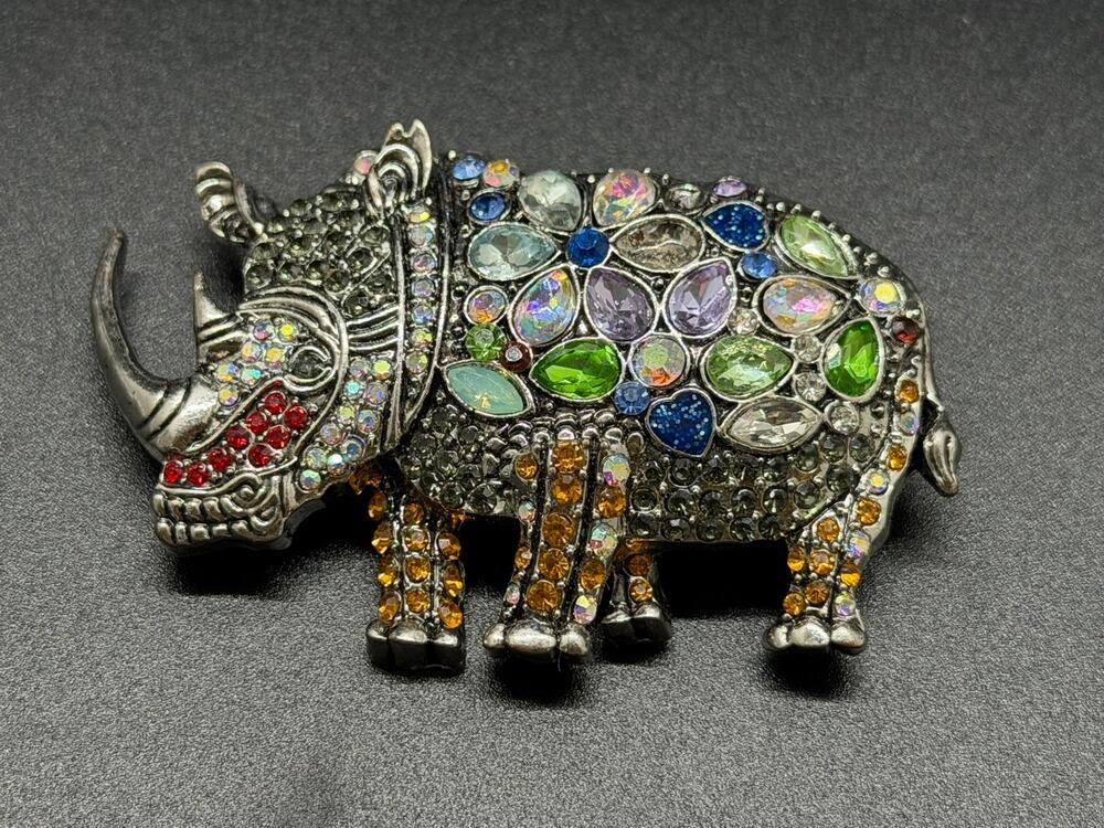 Ornate Rhinoceros brooch silver-toned body adorned with colorful rhinestones